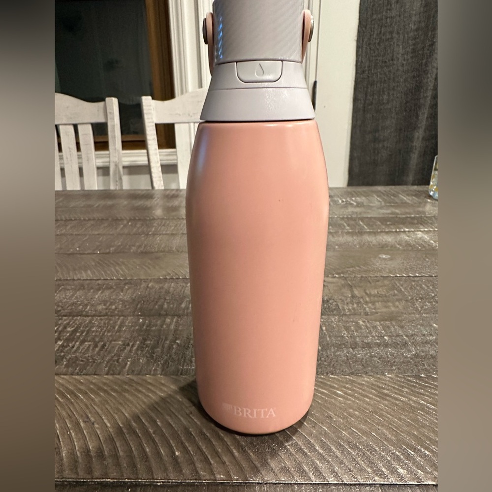 Brita Water Filter Bottle Coral/ Peach color. Like new